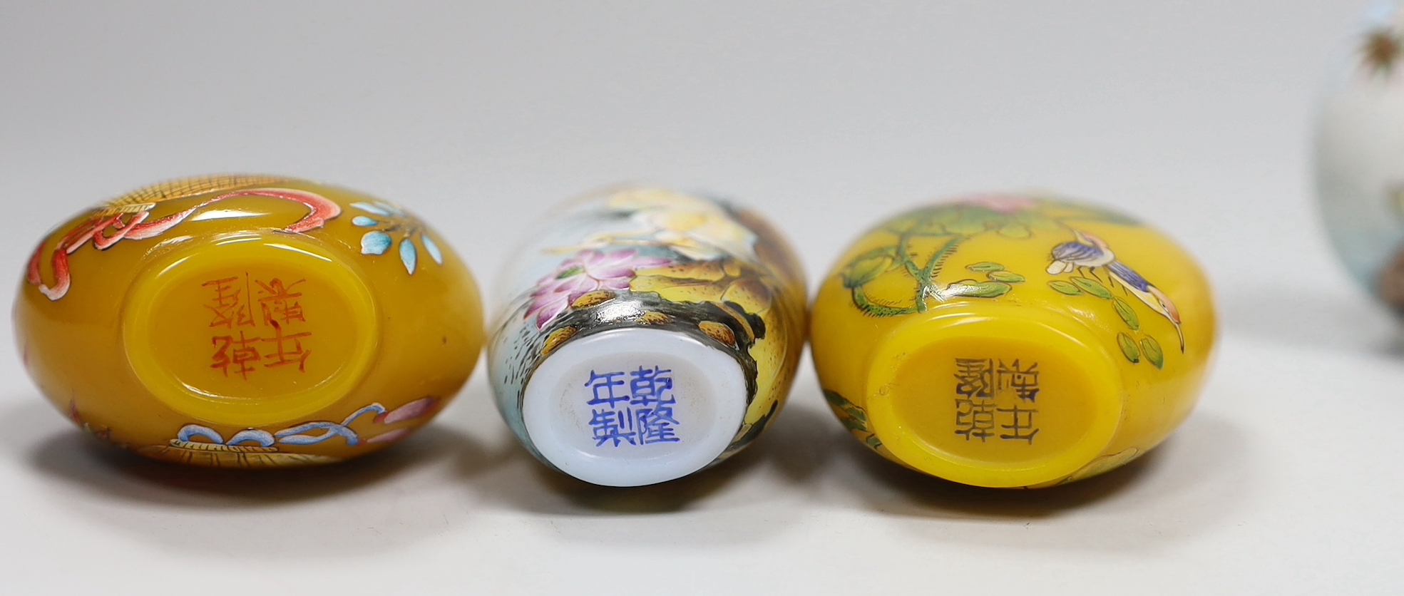 Seven Chinese enamelled glass bottles, tallest 9cm high